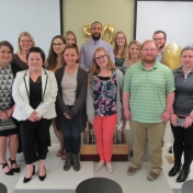 The 2018 Aurora Staff pose for a photo.